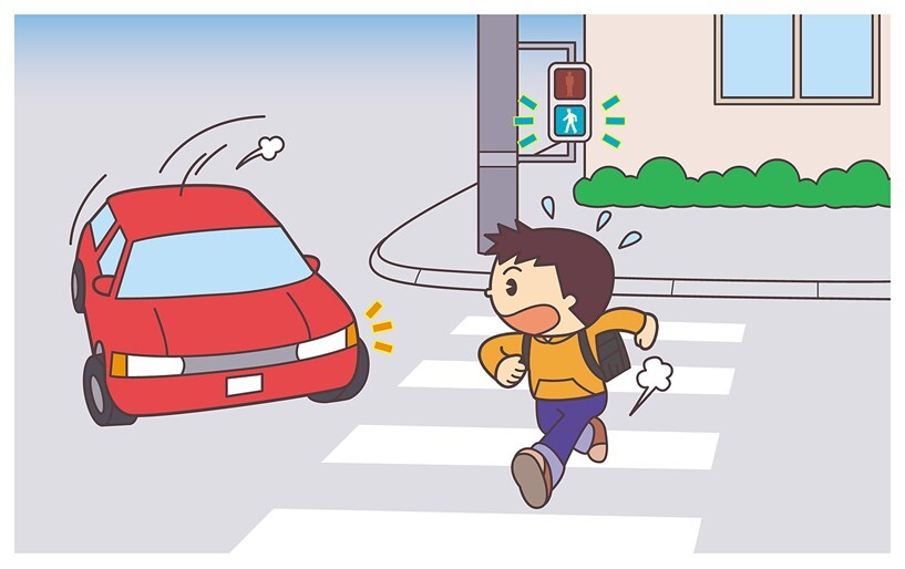 左折してきた車両に驚くこども